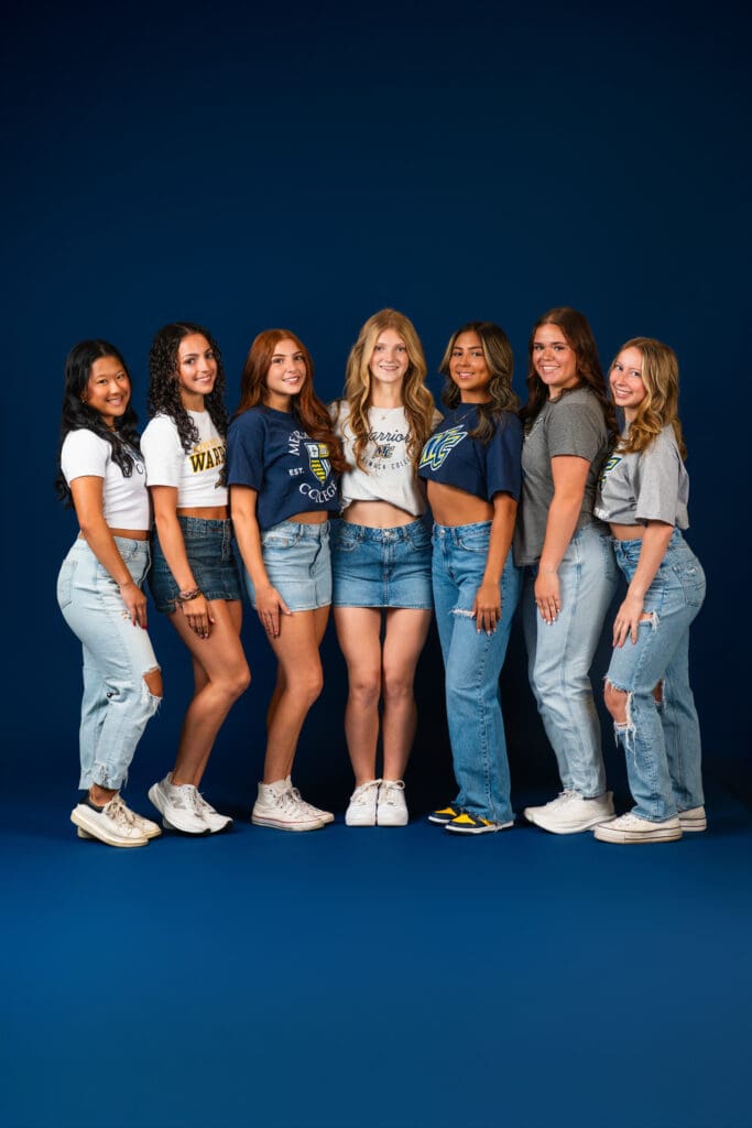 Group of dancers in team uniforms during studio media day