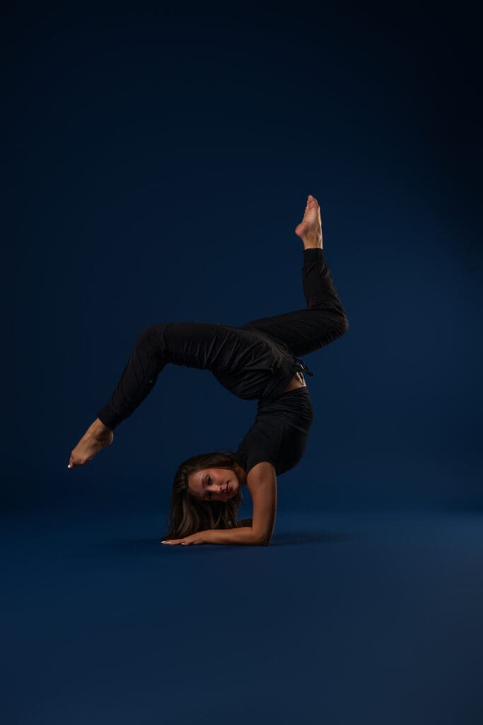 Contemporary dancer performing floor pose during media day