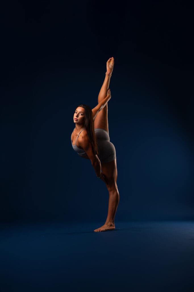 Dancer posing for headshot during dance media day session.